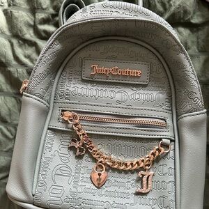 Juicy Couture Embossed Greenish Backpack with Gold Accents